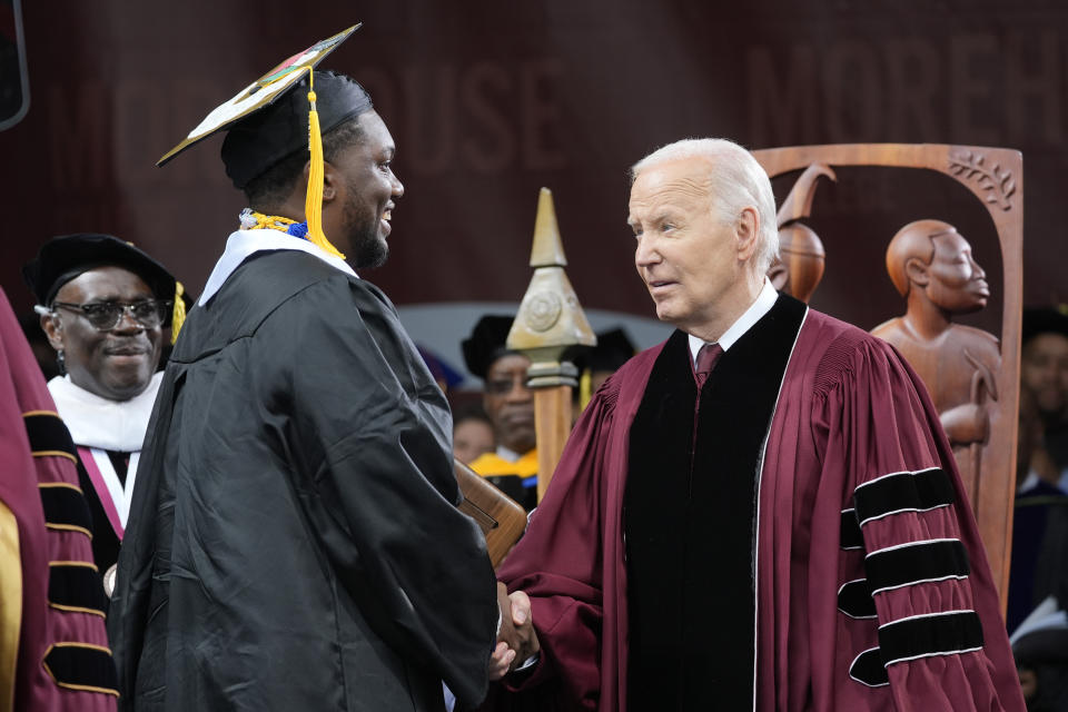 President Biden, right, congratulates valedictorian DeAngelo Jeremiah Fletcher at the Morehouse College commencement on Sunday. 