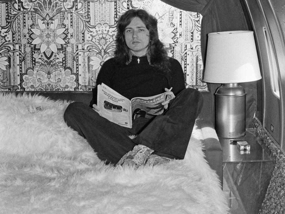Deep Purple singer Dave Coverdale on the white fur bedspread onboard the Starship.