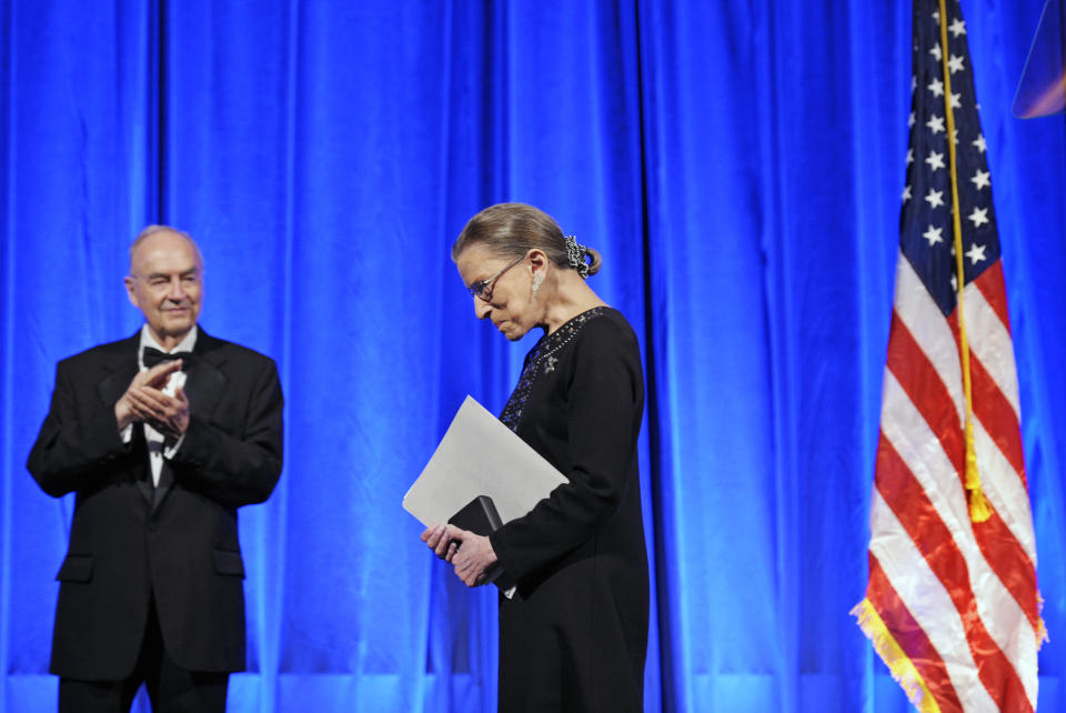 Former Sen. Harris Wofford, left, applauds as Supreme Court Associate Justice Ruth Bader Ginsburg leaves the stage after being awarded a Jefferson Award for Public Service. (Photo: Cliff Owen/AP)