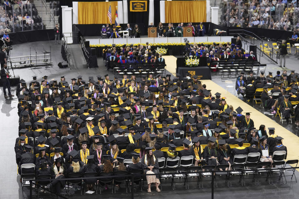 Students turn their chairs away from former U.S. Rep. Liz Cheney, R-Wyo., as she delivers the commencement address at Colorado College, Sunday, May 28, 2023, in Colorado Springs, Colo. (AP Photo/Jack Dempsey)