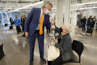 New York Mayor Bill de Blasio, bumps elbows with a woman after she was vaccinated, following his tour of the grand opening of a Broadway COVID-19 vaccination site intended to jump-start the city's entertainment industry, in New York, Monday, April 12, 2021. (AP Photo/Richard Drew, Pool)