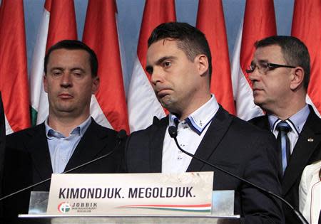 Gabor Vona (C), chairman of the far-right Jobbik party, reacts as he addresses supporters after partial results of parliamentary elections are announced in Budapest in this April 6, 2014 file photo. REUTERS/Bernadett Szabo/Files