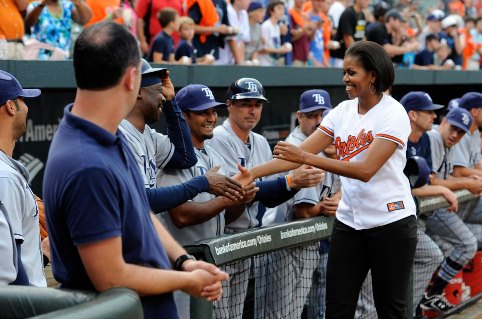 First lady Michelle Obama shakes hands with members of the Tampa Bay Rays before the game against the Baltimore Orioles at Camden Yards on July 20, 2010 in Baltimore, Maryland. / Credit: Greg Fiume / Getty Images