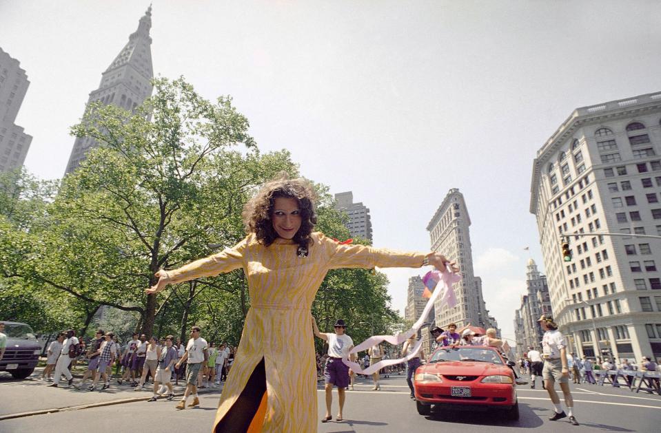 Stonewall veteran Sylvia Rivera leads the ACT-UP march past New Yorkís Union Square Park, June 26, 1994. The march was one of two held on Sunday to commemorate the 25th anniversary of the riot at the Stonewall Inn, a Greenwich Village bar that erupted in violence during a police raid in 1969. The incident is now considered the start of the gay rights movement. Virtually every reliable account credits Sylvia, a man who prefers the feminine pronoun, with a major role in the riot.