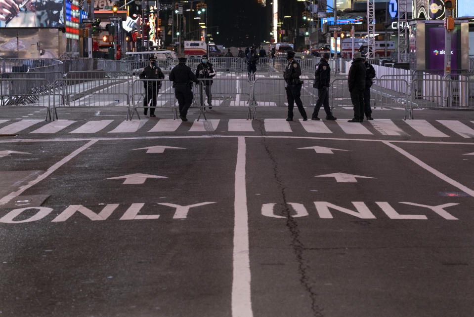 Seventh Avenue is mostly empty during what would normally be a Times Square packed with people in New York, late Thursday, Dec. 31, 2020, as celebrations have been truncated this New Year's Eve due to the ongoing pandemic. (AP Photo/Craig Ruttle)