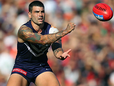 Big unit: Fremantle's Clancee Pearce handball's during the Dockers heavy defeat of Essendon