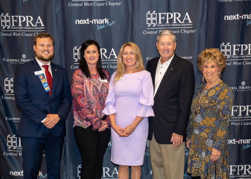 Travis Cornwell, of Next-Mark, left, Erin Guzzo, Boys & Girls Clubs of Sarasota and DeSoto Counties, CWC-FPRA President Sheryl Vieira, Caldwell Trust Co., and Joe Curley and Carol Schoff, Sir Speedy.