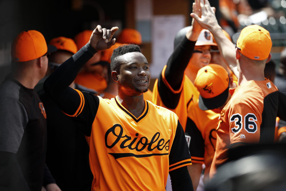 Baltimore Orioles' Tim Beckham gestures to teammate Renato Nunez from the dugout after scoring on Nunez's single in the second inning of a baseball game against the New York Yankees, Saturday, Aug. 25, 2018, in Baltimore. (AP Photo/Patrick Semansky)