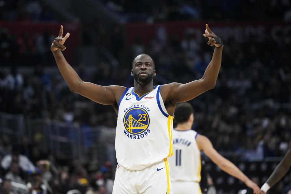 Golden State Warriors' Draymond Green (23) celebrates his 3-point basket during the first half of the team's NBA basketball game against the Los Angeles Clippers on Wednesday, March 15, 2023, in Los Angeles. (AP Photo/Jae C. Hong)