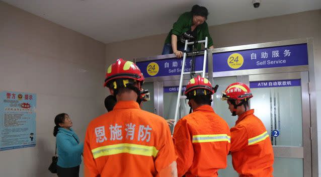 In 2009 two women had to be rescued after being trapped inside an ATM. Source: Shanghai Daily