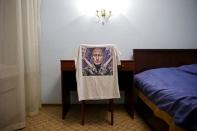 A t-shirt depicting Russian President Vladimir Putin is seen in this photo illustration taken in a hotel room in Kazan, Russia, August 5, 2015. REUTERS/Stefan Wermuth