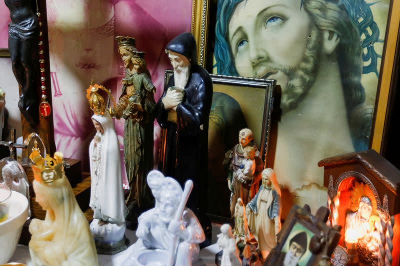 FILE PHOTO: Religious figures are seen on Najla Uchi's altar in her home in Manama