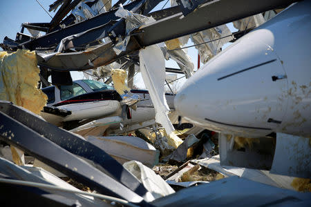 A damaged Baron twin-engine jet and Bombardier Challenger 350 jet are seen at the Eufaula Municipal Airport, after a string of tornadoes, in Eufaula, Alabama, U.S., March 5, 2019. REUTERS/Elijah Nouvelage