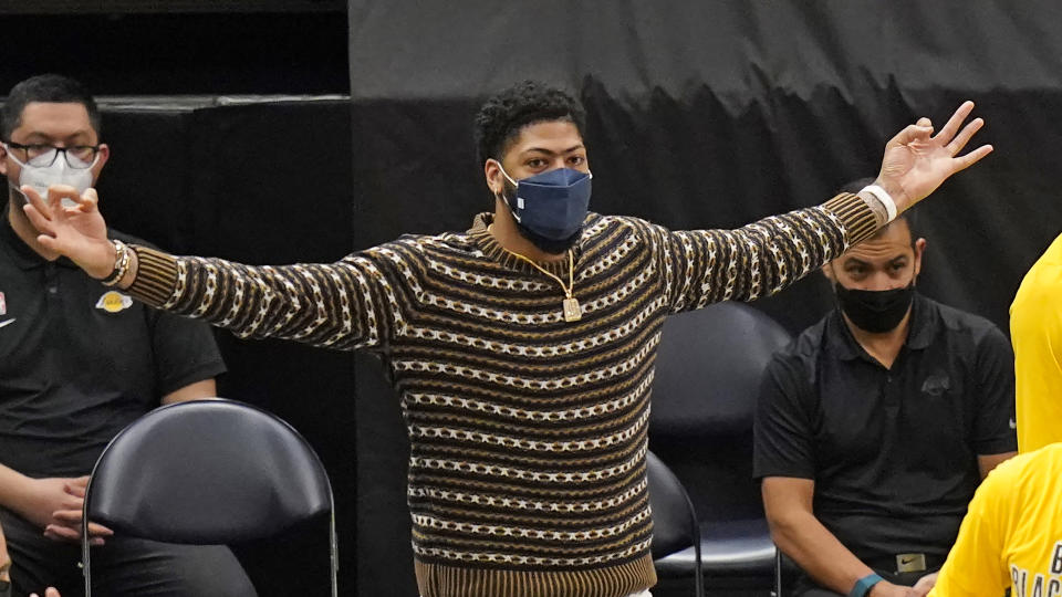 Los Angeles Lakers forward Anthony Davis gestures while watching the second half of the team's NBA basketball game against the Utah Jazz on Wednesday, Feb. 24, 2021, in Salt Lake City. (AP Photo/Rick Bowmer)