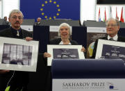 FILE - From left, Russia's Oleg Orlov, Lyudmila Alexeyeva and Sergei Kovalyov pose as the Russian activists received the European Union's top human rights award in recognition of the difficult conditions they face at home, Wednesday, Dec.16, 2009 in Strasbourg, at the European Parliament, France. On Friday, Oct. 7, 2022 the Nobel Peace Prize was awarded to jailed Belarus rights activist Ales Bialiatski, the Russian group Memorial and the Ukrainian organization Center for Civil Liberties. (AP Photo/Christian Lutz, File)
