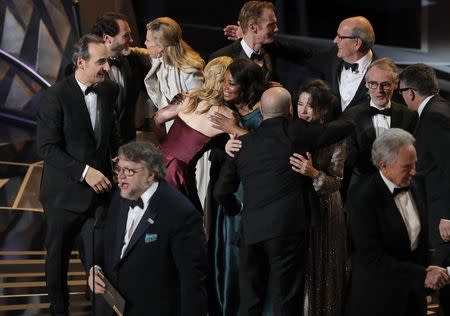 90th Academy Awards - Oscars Show - Hollywood, California, U.S., 04/03/2018 - Guillermo del Toro (L) accepts the Oscar for Best Picture for "The Shape of Water." REUTERS/Lucas Jackson