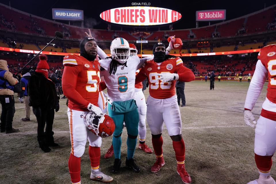 Jan 13, 2024; Kansas City, Missouri, USA; Kansas City Chiefs defensive end Mike Danna (51) defensive tackle Tershawn Wharton (98) and Miami Dolphins linebacker Melvin Ingram (9) pose for a photo following the 2024 AFC wild card game at GEHA Field at Arrowhead Stadium. Mandatory Credit: Denny Medley-USA TODAY Sports