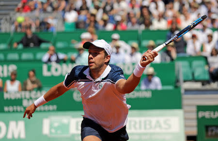 Tennis - Monte Carlo Masters - Monaco, 19/04/2017. Gilles Muller of Luxemburg plays a shot to Andy Murray of Britain. REUTERS/Eric Gaillard