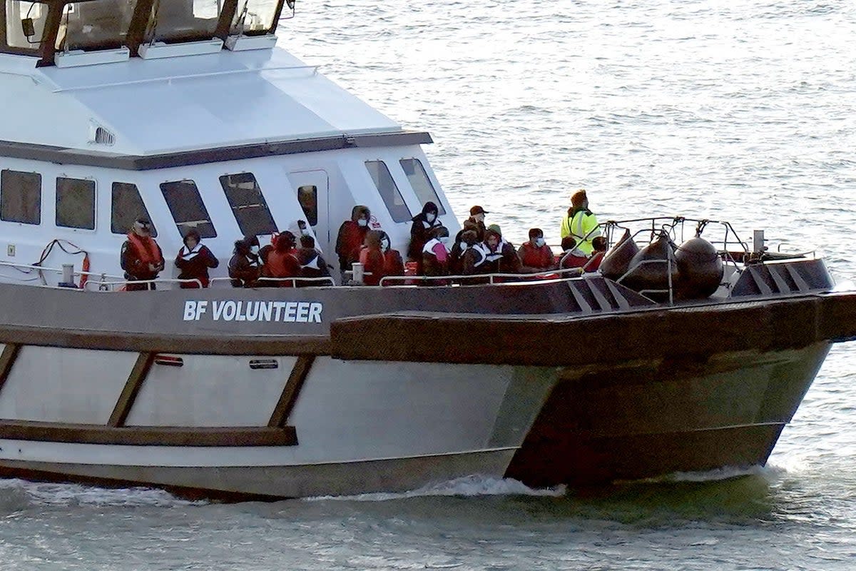 A group of people thought to be migrants are brought in to Dover, Kent, onboard a Border Force vessel following a small boat incident in the Channel (Gareth Fuller/PA) (PA Wire)