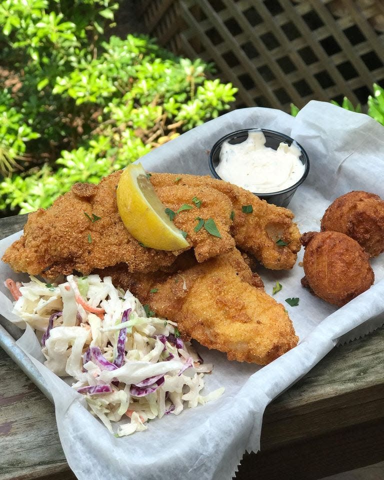 The crusted Louisiana catfish served with slaw, Cajun remoulade and corn puppies is one of the dishes served at Trust General Store and Cafe in Hot Springs.