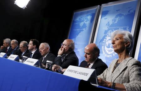 OECD Secretary General Jose Angel Gurria (from 2nd L-R), Italy's Finance Minister Pier Carlo Padoan, Britain's Chancellor of the Exchequer George Osborne, Germany's Finance Minister Wolfgang Schaeuble, France's Finance Minister Michel Sapin, Spain's Finance Minister Luis de Guindos and International Monetary Fund (IMF) Managing Director Christine Lagarde hold a news conference at the IMF/World Bank Spring Meetings in Washington April 14, 2016. REUTERS/Jonathan Ernst