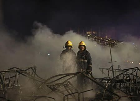 Firefighters try to extinguish a fire at the venue of a cultural event during 'Make in India' week in Mumbai, India, February 14, 2016. REUTERS/Danish Siddiqui