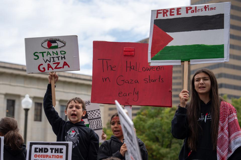 Yousef Isleem, 9, Sila Isleem, 8, and Aliya Isleem, 12, shout chants in support of Palestinians and Muslims in Gaza during a rally Saturday in front of the Ohio Statehouse in downtown Columbus.