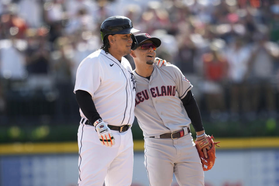 Detroit Tigers' Miguel Cabrera, left, hugs Cleveland Guardians second baseman Andres Gimenez after hitting a double in the fourth inning of a baseball game, Saturday, Sept. 30, 2023, in Detroit. (AP Photo/Paul Sancya)