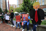 <p>Protesters hold their banners in front of the Alexandria Federal Court in Alexandria, Va., Tuesday, July 31, 2018, on day one of Paul Manafort’s trial. (Photo: Manuel Balce Ceneta/AP) </p>
