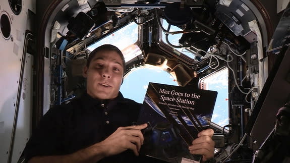 Expedition 37/38's Mike Hopkins reads "Max Goes to the Space Station" (Big Kid Science, 2013) by Jeffrey Bennett.