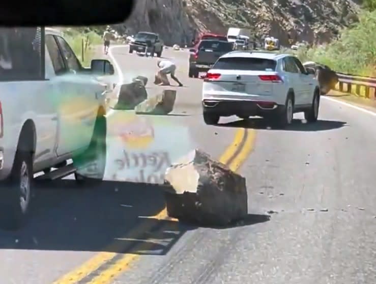 Boulders block U.S. Route 395 near the California state line with Nevada, after an earthquake Thursday, July 8, 2021.