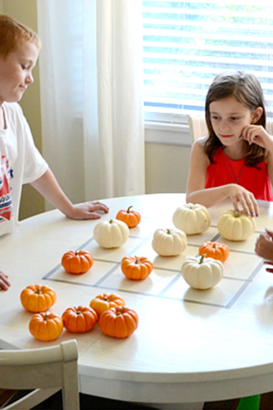 <p>Put a fall spin on this classic game. All you'll need are mini pumpkins in two different colors.</p><p><strong>Get the tutorial at <a href="http://www.itsoverflowing.com/2012/11/create-a-kids-game/" rel="nofollow noopener" target="_blank" data-ylk="slk:It's Overflowing;elm:context_link;itc:0" class="link ">It's Overflowing</a>.</strong> </p><p><a class="link " href="https://www.amazon.com/Colored-Masking-Decorative-Journals-Scrapbooking/dp/B094QSDP85?tag=syn-yahoo-20&ascsubtag=%5Bartid%7C10050.g.4698%5Bsrc%7Cyahoo-us" rel="nofollow noopener" target="_blank" data-ylk="slk:Shop Now;elm:context_link;itc:0">Shop Now</a></p>