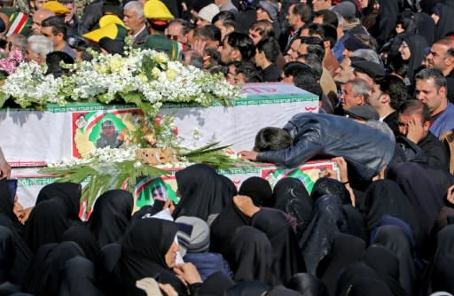 Iranians mourn on February 16, 2019 at the coffins of Revolutionary Guards members killed in a suicide attack