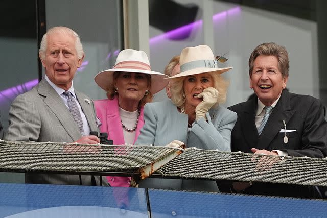 <p>Aaron Chown/PA Images via Getty</p> King Charles and Queen Camilla attend horse racing at Epsom Downs Racecourse on May 31, 2024