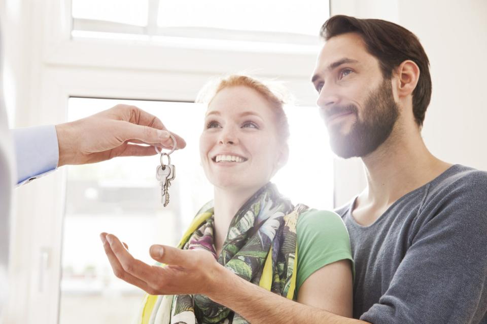 couple receiving a house key