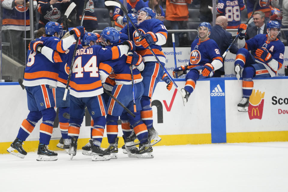 against the New York Islanders celebrate after defeating the Dallas Stars during overtime of an NHL hockey game Sunday, Jan. 21, 2024, in Elmont, N.Y. (AP Photo/Mary Altaffer)