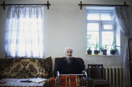 Silvard Atajyan, 103, sits at home during an interview with Reuters in Yerevan, April 20, 2015. REUTERS/David Mdzinarishvili