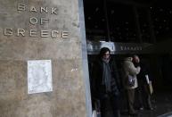 People exit the headquarters of the Bank of Greece in central Athens, February 12, 2015. REUTERS/Alkis Konstantinidis