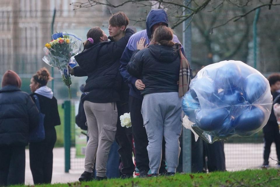 People at a vigil for murdered teenager Harry Pitman (PA)