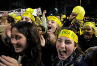 People demonstrate against abortion legalization in downtown Montevideo, Uruguay, Monday, Sept. 24, 2012. Demonstrators protested the day before a congressional bill legalizing abortion is voted on. The headbands read in Spanish "yes to life." (AP Photo/Matilde Campodonico)