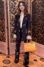 <p><strong>March 2019</strong> Jenna Coleman matched her Gucci bag to the orange flowers in her suit.</p>