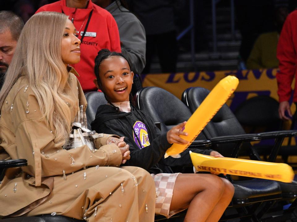 Zhuri James (right) and her mom, Savannah, attend a Los Angeles Lakers game.