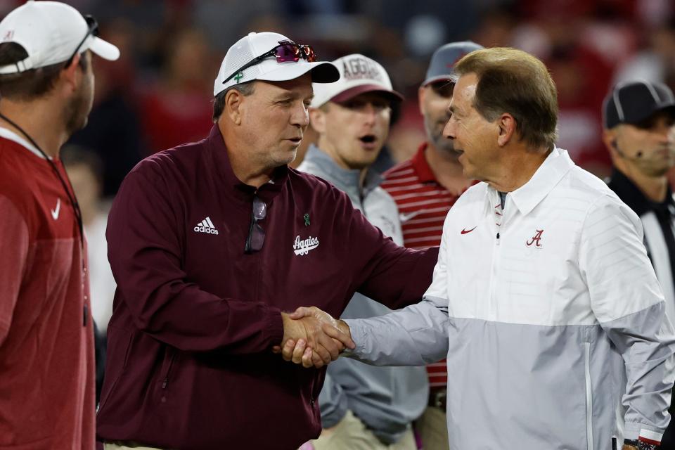 Texas A&M coach Jimbo Fisher shakes hands with Alabama's Nick Saban before the 2022 game in Tuscaloosa, won by the Crimson Tide. The two meet in College Station Saturday. An A&M win would cripple Alabama's chances of making the College Football Playoff.