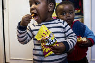 <p>Two children take a snack break in Zanethemba Kidz Haven School. The school is an early childhood development center that’s focused on child educational development, nutrition, and healthcare for orphaned and displaced children in the poorest area of Phillippi. (Photograph by Silvia Landi) </p>