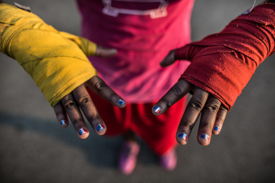 <p>Claressa Shields has red, white and blue painted on her finger nails a month before she gets ready to go to the Olympic Games in London. The flags turned out more French than American but Claressa didn’t mind. (Photograph by Zackary Canepari) </p>