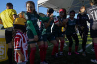 The Mexico women's team dances together while waiting to take the field for a match against Denmark at the Homeless World Cup, Tuesday, July 11, 2023, in Sacramento, Calif. (AP Photo/Godofredo A. Vásquez)
