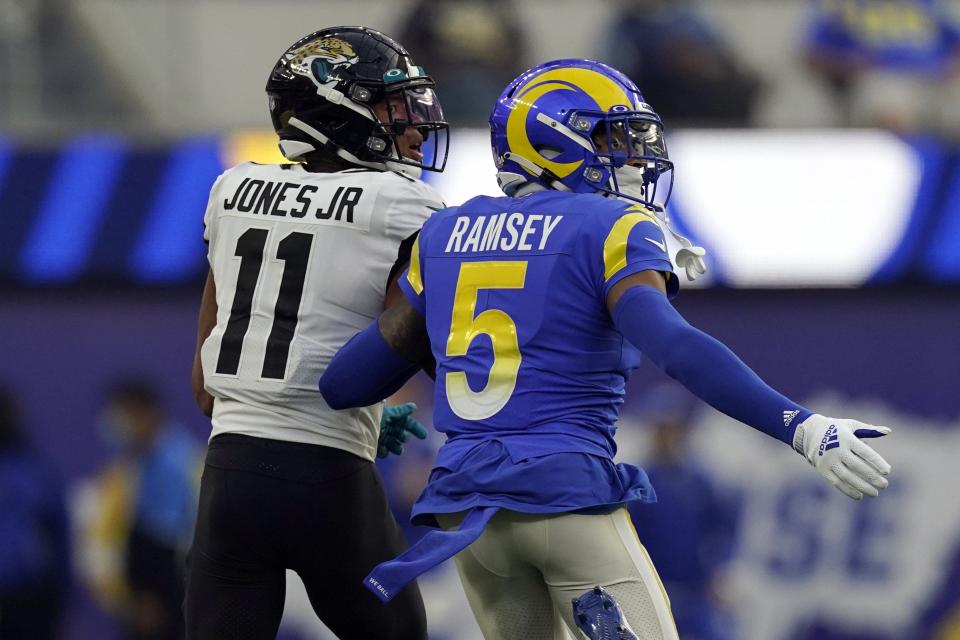 Los Angeles Rams cornerback Jalen Ramsey (5) defends on Jacksonville Jaguars wide receiver Marvin Jones (11) during the second half of an NFL football game Sunday, Dec. 5, 2021, in Inglewood, Calif. (AP Photo/Mark J. Terrill)