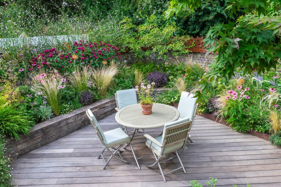 a table and chairs on a deck