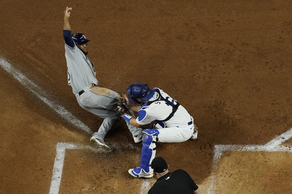 Los Angeles Dodgers catcher Will Smith tags out Tampa Bay Rays' Manuel Margot at home during the second inning in Game 2 of the baseball World Series Wednesday, Oct. 21, 2020, in Arlington, Texas. (AP Photo/David J. Phillip)