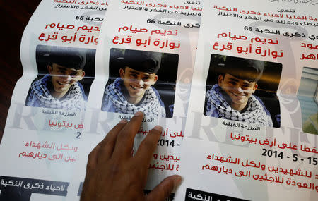 Pictures of 17-year-old Palestinina Nadim Nuwara are shown at the office of Accountability for Violence Against Children organization, in Ramallah, in the occupied West Bank April 25, 2018. REUTERS/Mohamad Torokman